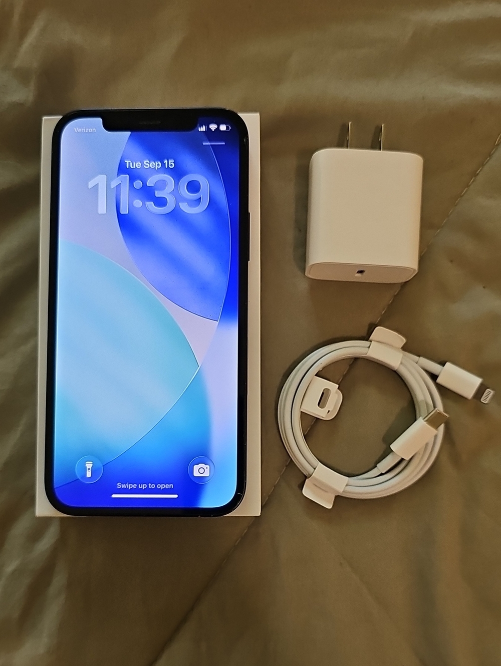 Unlocked Apple iPhone 12 64GB with New white charging cable & adapter.